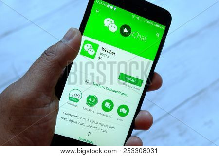 Bandar Seri Begawan,brunei - July 25th,2018 : A Male Hand Holding Smartphone With Wechat Apps On An 