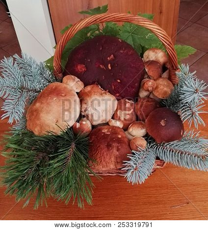 Pool Of Fresh Porcini Into A Wicker Basket
