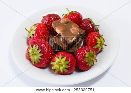 Plate Full Of Tasty Juicy Strawberries And Chocolate Isolated On Black Background