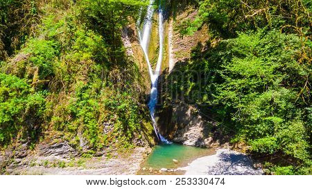 Drone View Of Orekhovsky Waterfall And Vegetation On The Steep Rock In Sunny Summer Day, Sochi, Russ