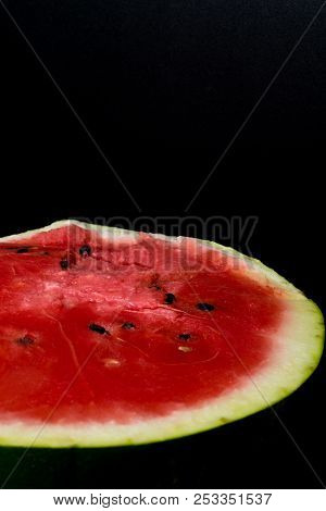 One Watermelon Cut In Halves Isolated On Black Background With Clipping Path