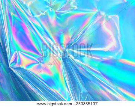 Holographic And Iridescent Blue Foil Surface Or Texture.
