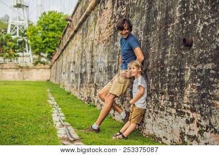 Dad And Son On Background Of Fort Cornwallis In Georgetown, Penang, Is A Star Fort Built By The Brit