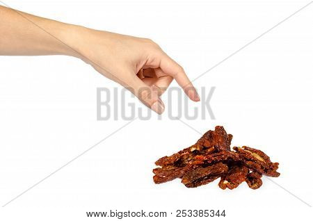 Sun Dried Red Tomatoes With Hand Isolated On White Background