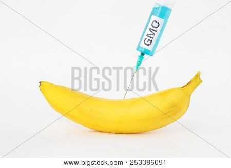 Banana On A White Background In Which Gmo And Nitrates Are Injected, Close-up, Genetically Modified 