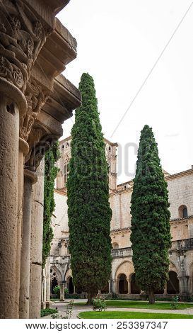 Detail Of A Romanesque Cloister In Santa Maria De Poblet Monastery,