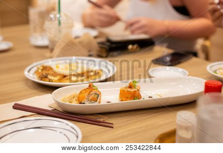 Sushi Salmon Roll With Crispy Tempura Shrimp, Japanese Traditional Dish. Family Dinner Concept.