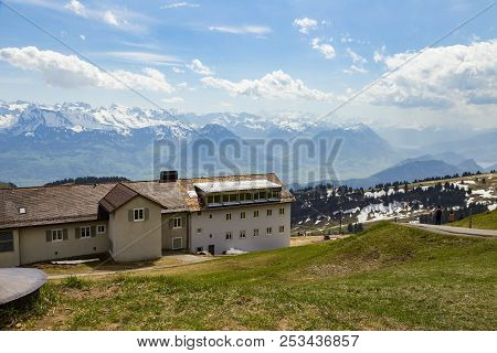 Green Grass Field On Top Of Rigi Kulm Luzern Switzerland With Alps Snow Mountain View A
