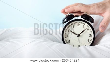 Alarm Clock On The Pillows. Advertizing Concept, Copy Space