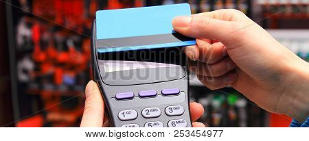 Using Payment Terminal For Paying With Contactless Credit Card With Nfc Technology In Shop, Cashless