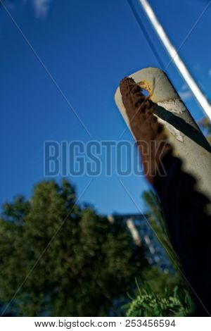 Thick Steel Rope Close Up. Bridge Fence Element. Detailed View. The Surface Of The Steel Cable Is Co