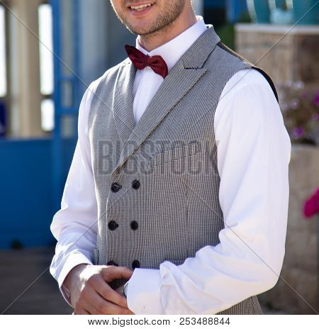 Groom Wedding Suit Gray In A Cage With A Bard Butterfly And A White Shirt