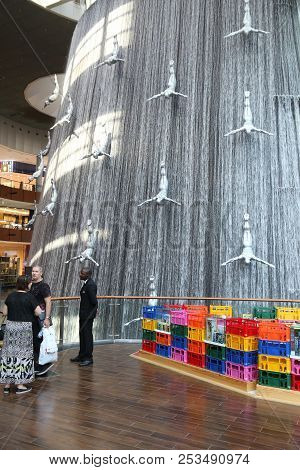 Dubai, Uae - November 22, 2017: Shoppers Visit The Human Waterfall Art Piece At Dubai Mall. It Is Th