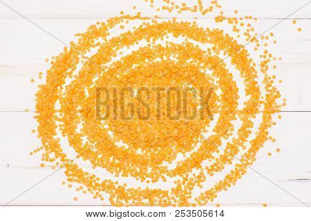 Lot Of Whole Sunny Raw Red Lentils Flatlay On Grey Wood
