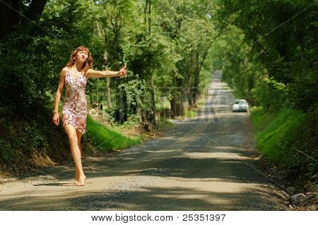 Pretty girl hitching hiking.