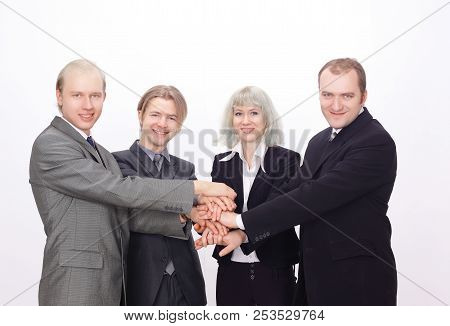Group Of Business People With Hands Clasped Together.