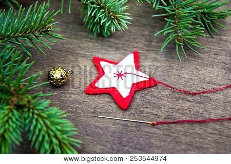 Christmas Party Preparation Background With Sewing Star Figure From Red Anf White Felt, Needle With 