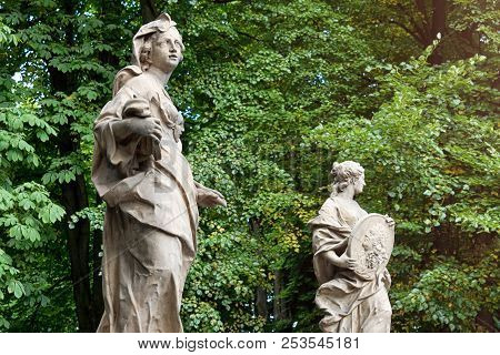 Sandstone Statues In The Saxon Garden, Warsaw, Poland. Made Before 1745 By Anonymous Warsaw Sculptor