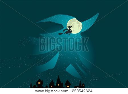 Halloween Theme: Beautiful Witch Flies On Broomstick Over Town Buildings Against The Background Of D