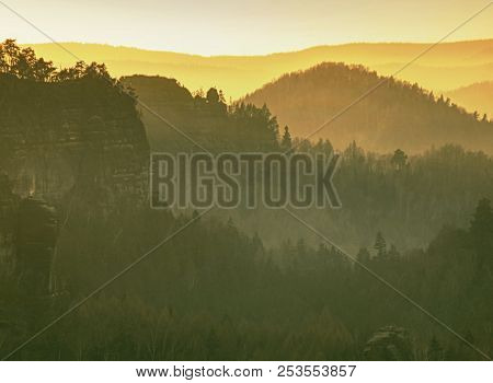 Beautiful Misty Sunrise In Toned Picture . Autumn Hilly Landscape Covered With Shinning Fog.  Sharp 