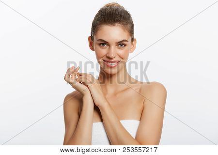 Happy Beautiful Girl Holding On Side With A Laugh. Expressive Facial Expressions .cosmetology And Sp