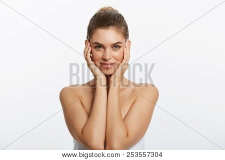Happy Beautiful Girl Holding Her Cheeks With A Laugh Looking To The Side. Expressive Facial Expressi