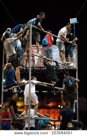 Romania, Bucharest - August 10, 2018: Protesters Climbed A Metal Figure In Victoria Square