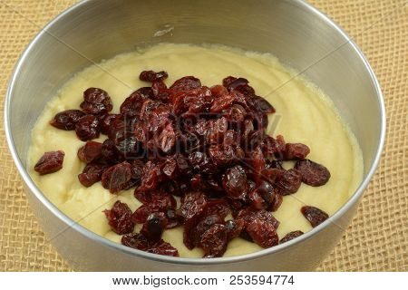Making Thanksgiving Cranberry Muffins In Stainless Steel Mixing Bowl With Muffin Dough Mix And Added