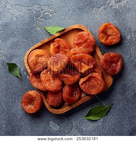 Dried Apricots On Gray Background With Copy Space. Top View.