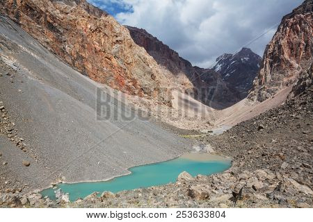 Beautiful serene lake in  Fann mountains (branch of Pamir) in Tajikistan.