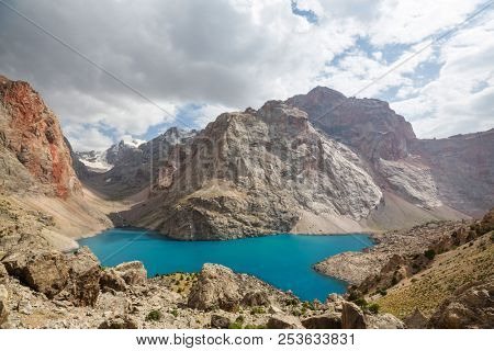 Beautiful serene lake in  Fann mountains (branch of Pamir) in Tajikistan.