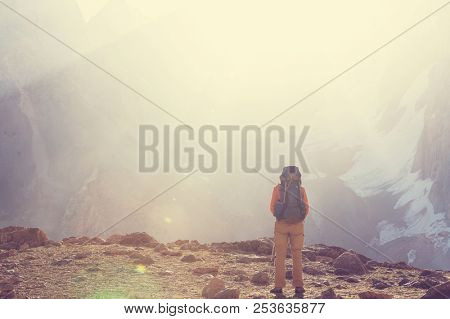 Wanderlust time. Man hiking in beautiful Fann mountains in Pamir, Tajikistan. Central Asia.