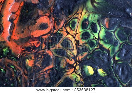 Abstract texture. Modern artwork background. Mixed black red and green pianting. Fluid Art. Unusual trendy background for poster, card, invitation. Contemporary art.