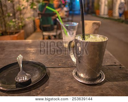 Cutlery And Ice Milk On The Wooden Teble In Restaurant