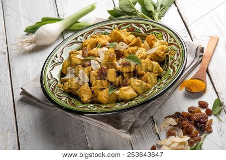 oriental meat stew with almond tumeric and dried grape
