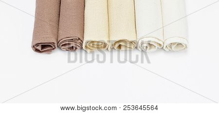 Multicolored Clean Towels On A White Background Top View With Copy Space. Texture Of Cotton, Waffle 