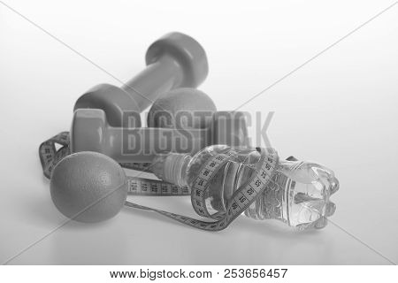 Diet And Sport Regime Concept. Sports And Healthy Regime Equipment. Dumbbells In Bright Green Color,
