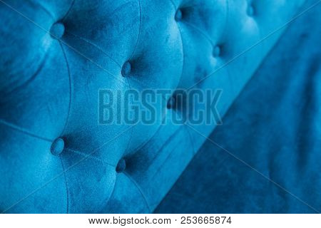 Velour Surface Of Sofa Close-up. Coach-type Velours Screed Tightened With Buttons. Blue Chesterfield