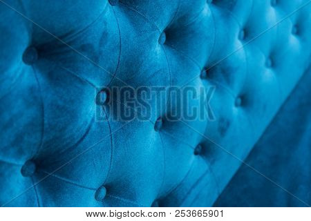 Velour Surface Of Sofa Close-up. Coach-type Velours Screed Tightened With Buttons. Blue Chesterfield