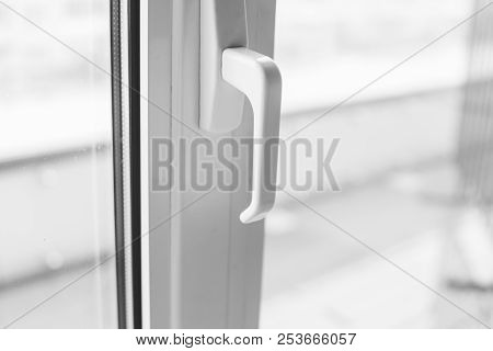 Close-up On A White Handle Of The Pvc Window.