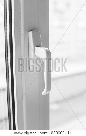 Close-up On A White Handle Of The Pvc Window.