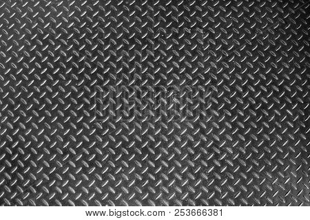 Steel Dirty And Used Checker Plate Metal Sheet. Can Be Use As Background Or Texture.