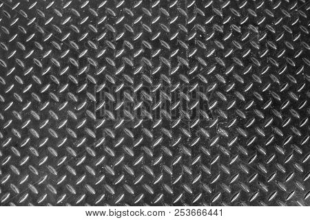Steel Dirty And Used Checker Plate Metal Sheet. Can Be Use As Background Or Texture.