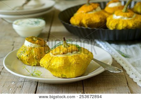 Pattypan Squash Or Pumpkins Stuffed With Ricotta With Basil And Dill And Served With Sour Cream Sauc