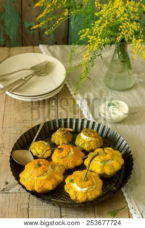Pattypan Squash Or Pumpkins Stuffed With Ricotta With Basil And Dill And Served With Sour Cream Sauc