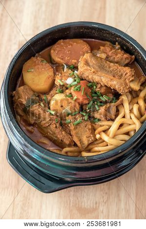 Gamjatang Korean Spicy Pork rib Soup with Kimchi and udon