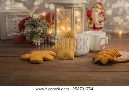 Cozy Winter At Home With Hot Drink And Cookies. Christmas Time With Tea And Garland With Copy Space