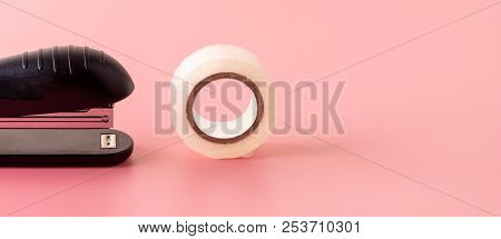 Stapler And Tape On Pink Background Back To School Education With Copy Space