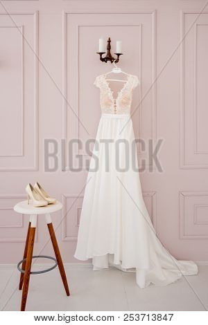 Grate Choice Of Gorgeous Fashion Dresses Hanging On Racks In Woman's Wardrobe. A Big Variety Of Spar