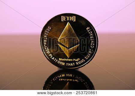 Etherum Money Crypto Currency Coin On Reflective Colorful Background